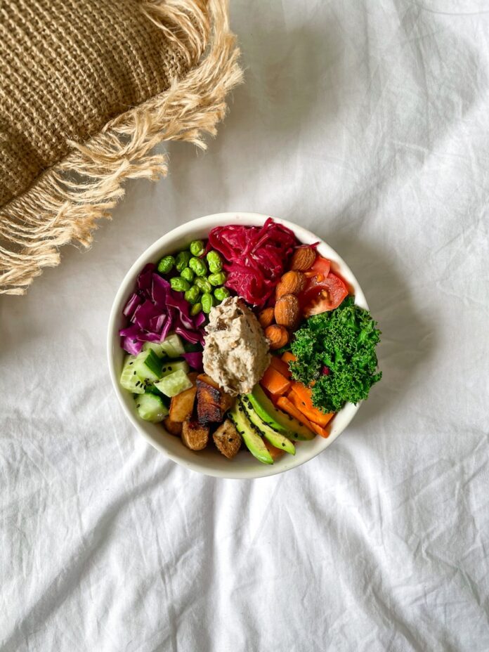 Photo by Calvin Shelwell vegetable salad on white ceramic bowl