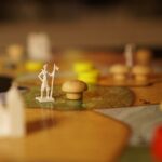 ‘뇌건강’ 지키는 일상 루틴, 지금 시작하는 작지만 큰 변화 a close up of a board game with figurines on it