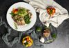 “소박한 한 끼의 힘, 일상 식단에 변화 주는 건강 트렌드” a white plate topped with meat and veggies