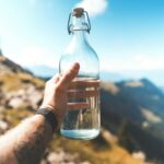 집콕 생활, 어떻게 건강하게 보낼까? 일상 속 실천 가능한 건강 관리법 person holding empty clear glass bottle